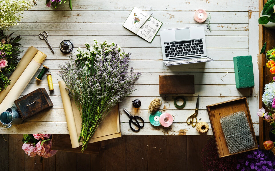 picture containing a laptop and flowers 